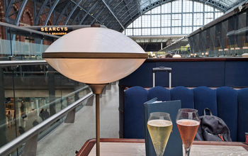 Two glasses of sparkling wine at St. Pancras International railway station in London