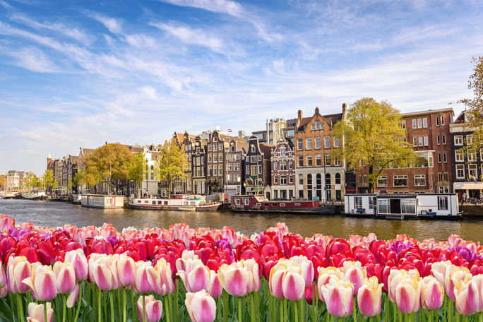 Historic buildings along a canal in Amsterdam, The Netherlands.