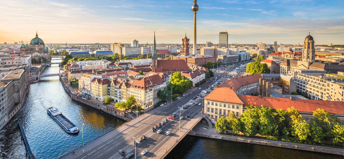 Image: Aerial view of Berlin skyline with famous TV tower and Spree river in beautiful evening light at sunset, Germany. (photo via bluejayphoto/iStock/Getty Images Plus)