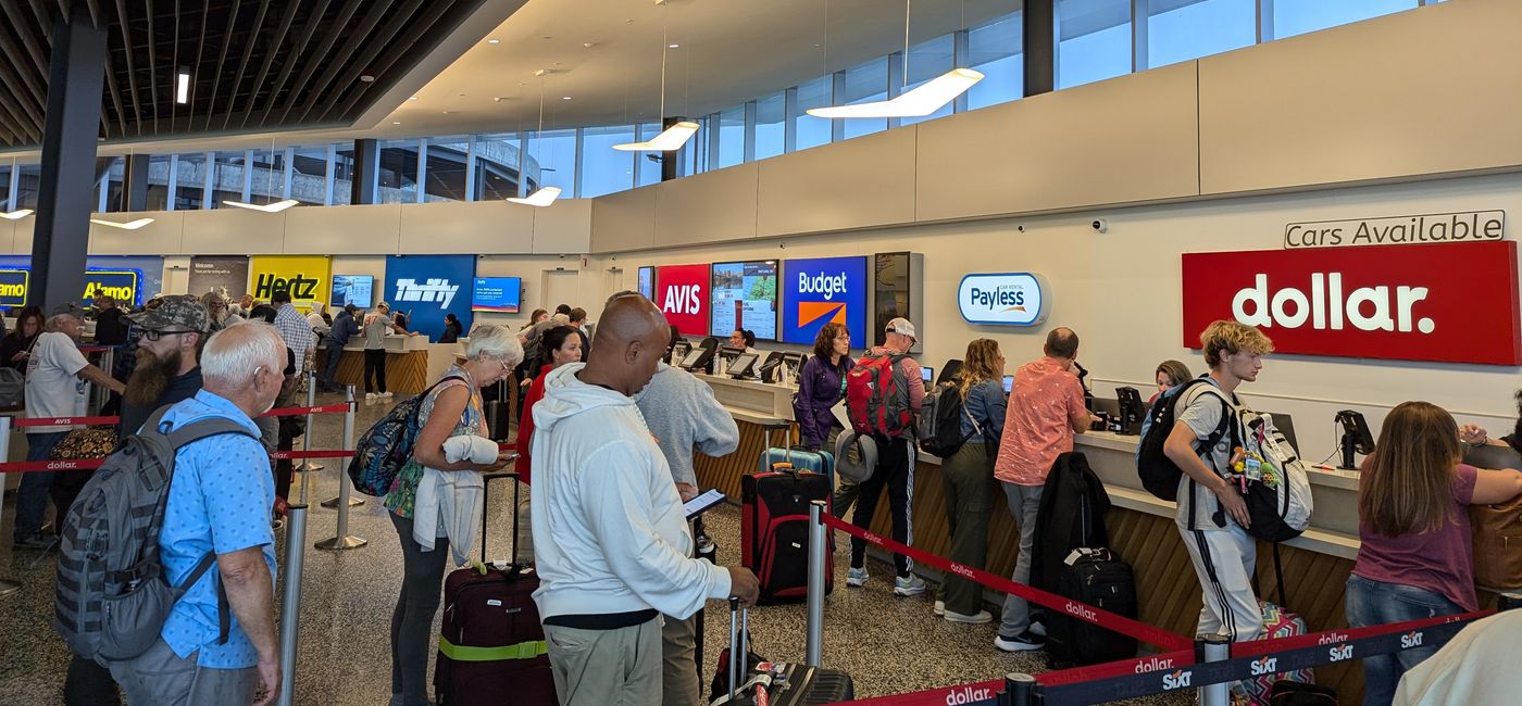 Image: Airport rental car pickup lines. (Photo Credit: Eric Bowman)