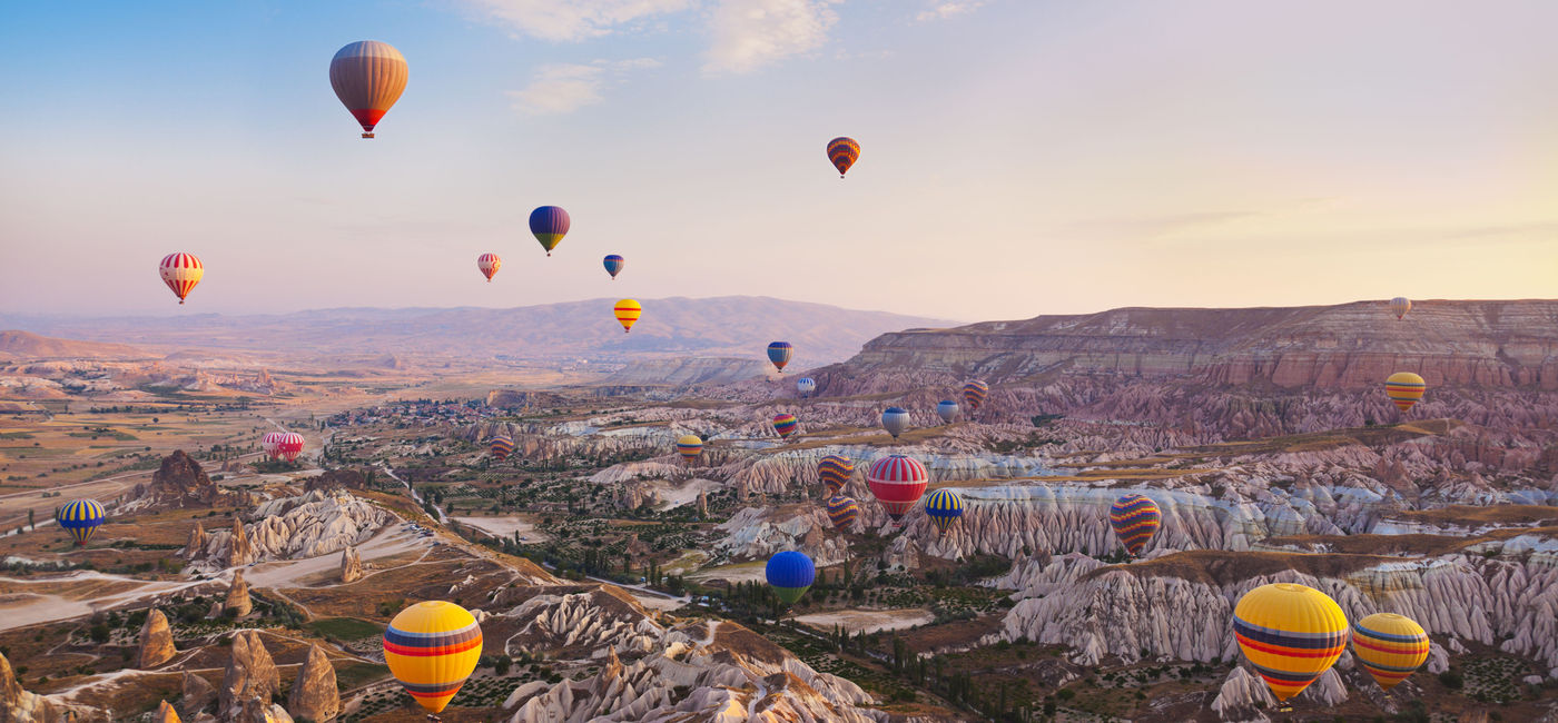 Image: Hot air balloons flying over Cappadocia, Turkey. (photo via TPopova/iStock/Getty Images Plus) (TPopova / iStock / Getty Images Plus)