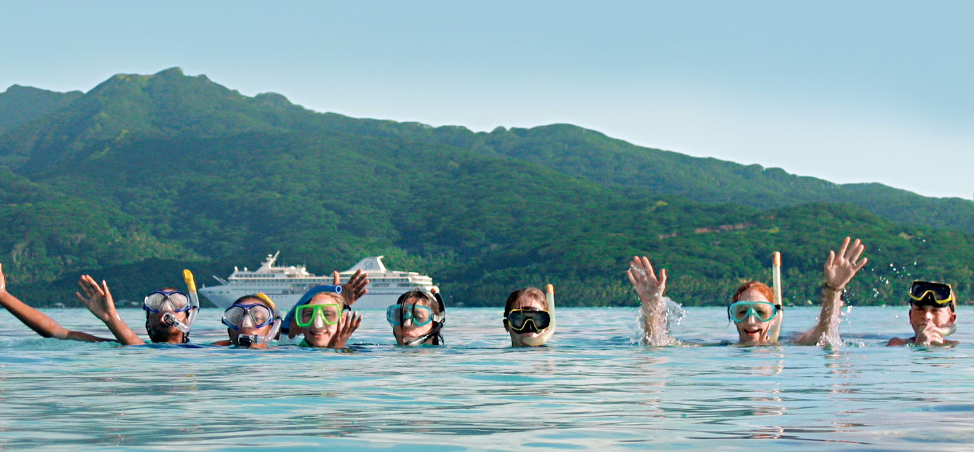 Image: Kids can snorkel with a guide in the South Pacific with Paul Gauguin's Moana Explorer Program sailings. (Photo Credit: Paul Gauguin Cruises)