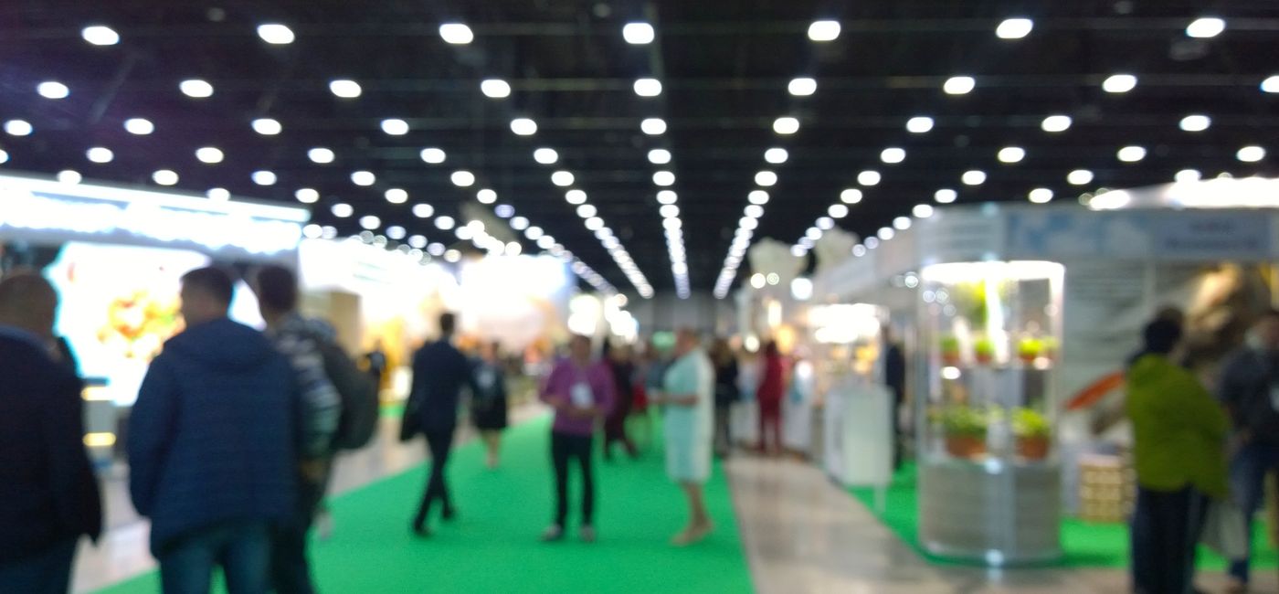 Image: People at a trade show. (Photo Credit: NVS my world / Adobe Stock)