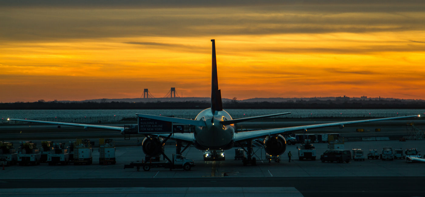 Image: Plane parked at JFK airport in New York. (Photo Credit: Beck / Adobe Stock)
