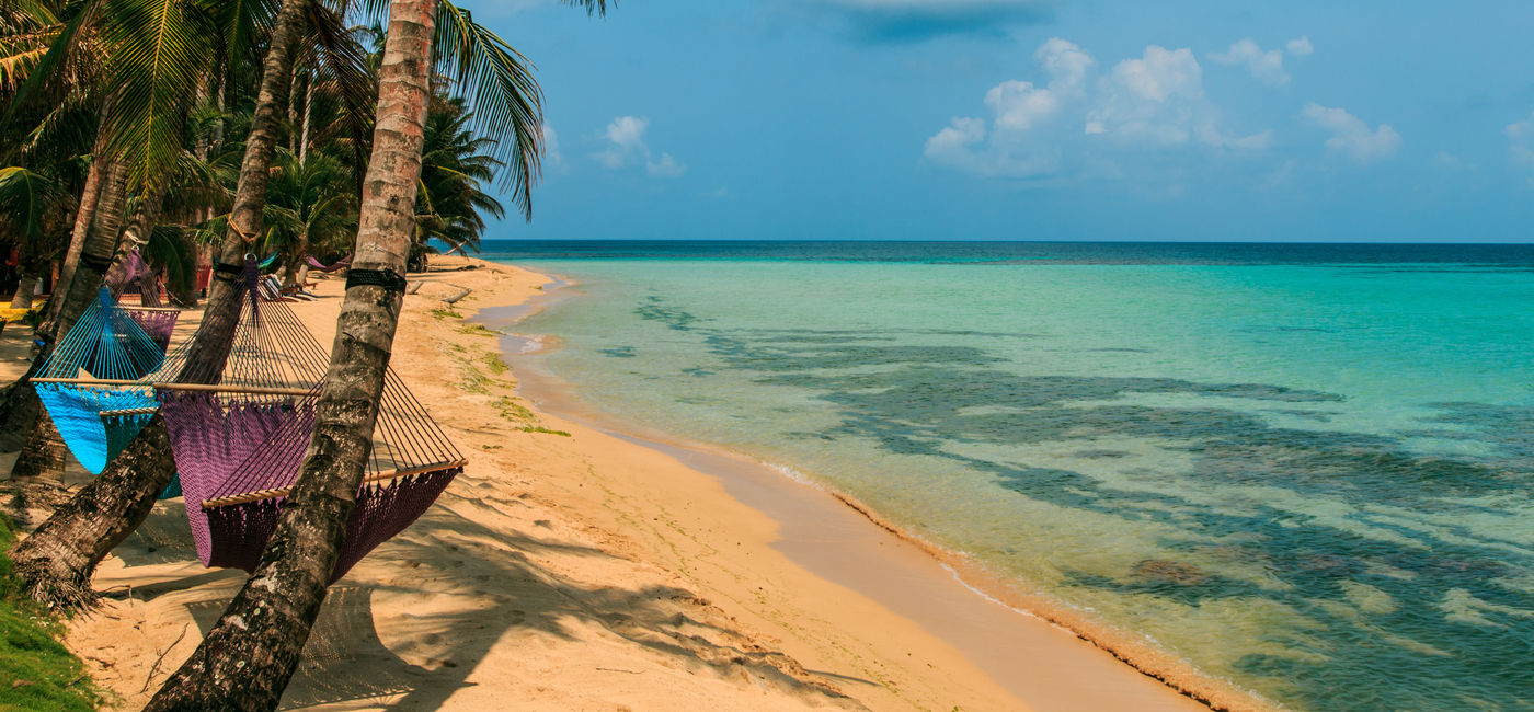 Image: tropical beach with hammock on palm, relax concept from Nicaragua (Photo via riderfoot / iStock / Getty Images Plus)