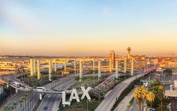 Overview of LAX airport with control tower and aircraft taken from hotel room