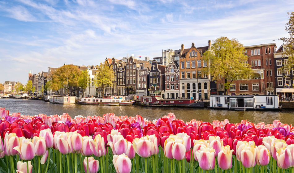 Historic buildings along a canal in Amsterdam, The Netherlands.